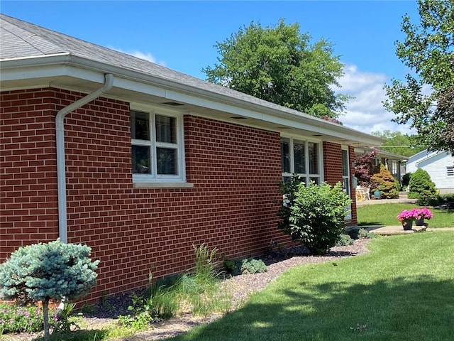1018 S Spring St, Palmyra, MO 63461 - view of side of property with brick siding and a lawn