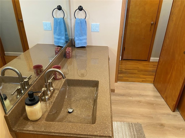 1018 S Spring St, Palmyra, MO 63461 - bathroom view of wood finished floors and a sink