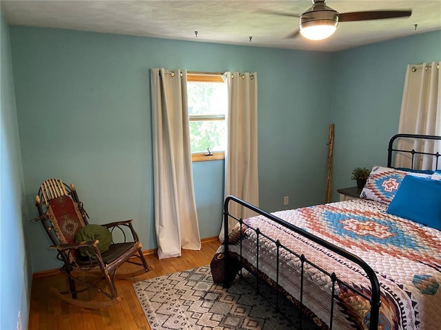 1018 S Spring St, Palmyra, MO 63461 - bedroom featuring light wood-style floors, baseboards, and a ceiling fan
