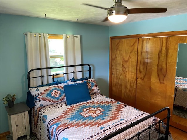 1018 S Spring St, Palmyra, MO 63461 - bedroom with wood finished floors and a ceiling fan