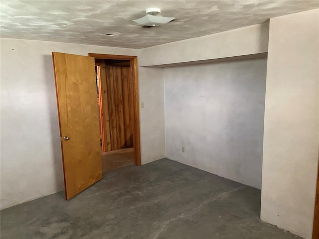 1018 S Spring St, Palmyra, MO 63461 - spare room featuring unfinished concrete floors