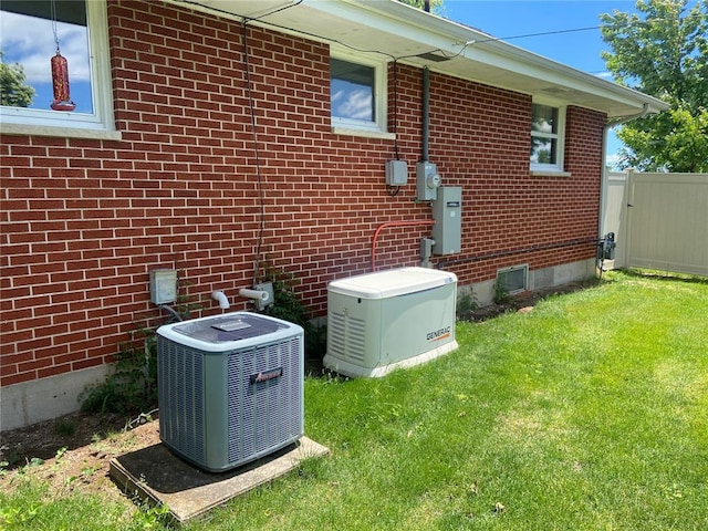 1018 S Spring St, Palmyra, MO 63461 - view of home's exterior featuring central air condition unit and brick siding