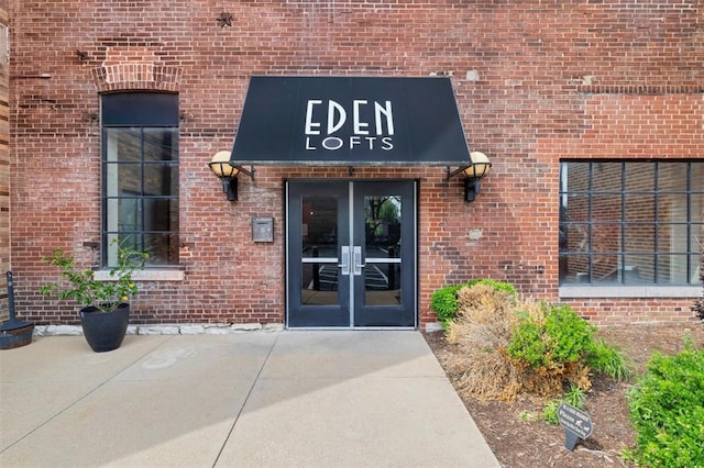 1720 Chouteau Ave Unit 110, Saint Louis, MO 63103 - view of exterior entry with french doors and brick siding
