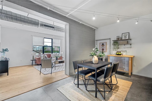 1720 Chouteau Ave Unit 110, Saint Louis, MO 63103 - dining space featuring rail lighting and concrete floors