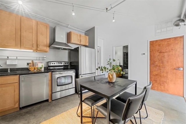 1720 Chouteau Ave Unit 110, Saint Louis, MO 63103 - kitchen with appliances with stainless steel finishes, wall chimney exhaust hood, finished concrete flooring, light brown cabinets, and a sink