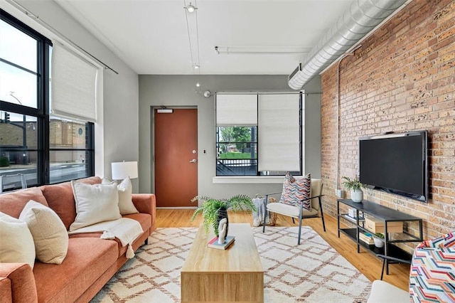 1720 Chouteau Ave Unit 110, Saint Louis, MO 63103 - living area with wood finished floors