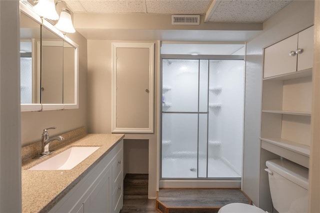 1104 Turkey Run, Rolla, MO 65401 - full bathroom featuring toilet, a stall shower, vanity, and wood finished floors