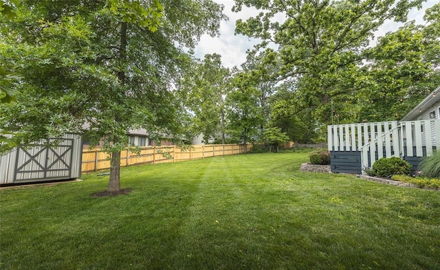1104 Turkey Run, Rolla, MO 65401 - view of yard with a wooden deck and a storage unit