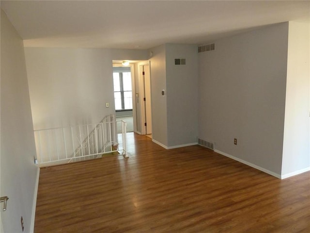 1133 Appleseed Ln Unit B, Saint Louis, MO 63132 - spare room featuring wood finished floors and baseboards