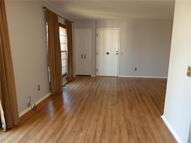 1133 Appleseed Ln Unit B, Saint Louis, MO 63132 - empty room with light wood-type flooring and baseboards
