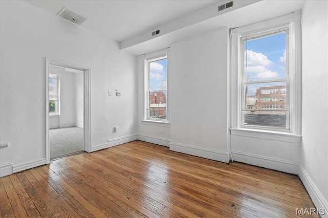 3124 Oregon Ave, Saint Louis, MO 63118 - unfurnished room with wood-type flooring and baseboards