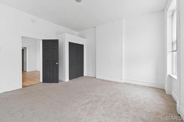 3124 Oregon Ave, Saint Louis, MO 63118 - unfurnished bedroom with carpet flooring, a closet, and baseboards