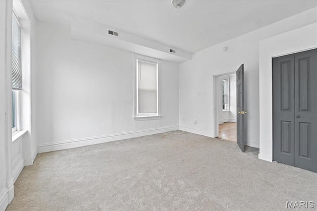 3124 Oregon Ave, Saint Louis, MO 63118 - unfurnished bedroom with carpet, baseboards, and a closet