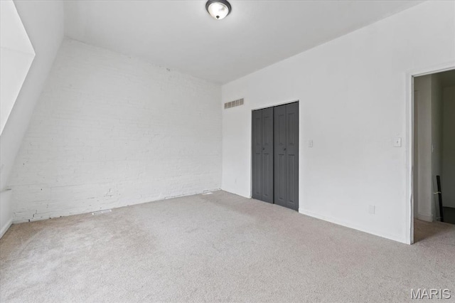 3124 Oregon Ave, Saint Louis, MO 63118 - carpeted spare room featuring brick wall