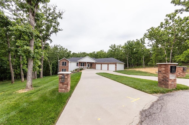 11475 Slate Cir, Rolla, MO 65401 - single story home with concrete driveway, a front lawn, and brick siding