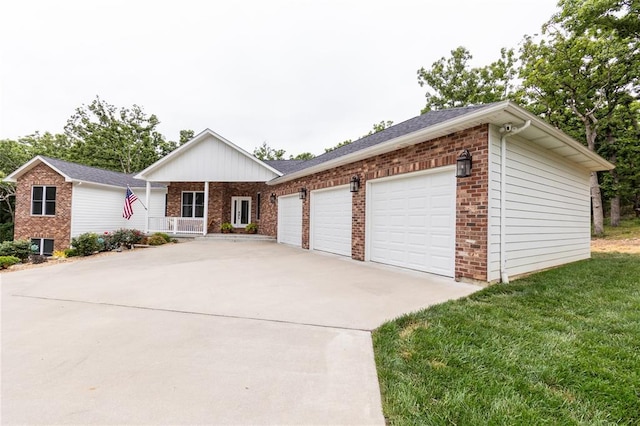 11475 Slate Cir, Rolla, MO 65401 - ranch-style home featuring driveway, a garage, brick siding, and a porch