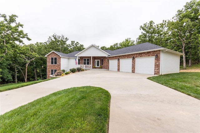 11475 Slate Cir, Rolla, MO 65401 - ranch-style house featuring brick siding, driveway, a front yard, an attached garage, and covered porch