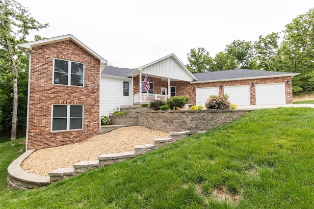 11475 Slate Cir, Rolla, MO 65401 - view of front of house with brick siding, a front lawn, driveway, and an attached garage