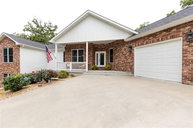 11475 Slate Cir, Rolla, MO 65401 - ranch-style home with concrete driveway, covered porch, an attached garage, and brick siding