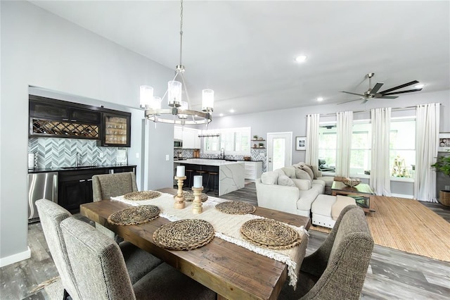 11475 Slate Cir, Rolla, MO 65401 - dining space with a chandelier, wood finished floors, ceiling fan, and recessed lighting