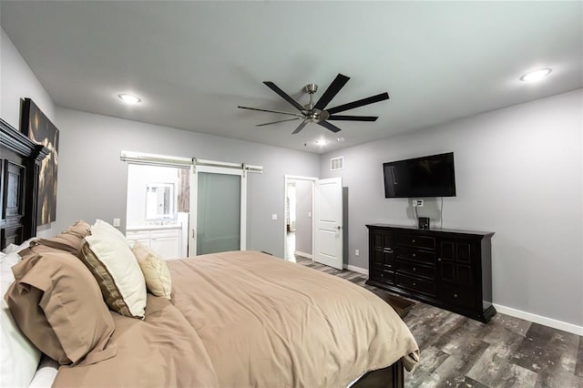 11475 Slate Cir, Rolla, MO 65401 - bedroom featuring a barn door, dark wood finished floors, baseboards, recessed lighting, and ceiling fan