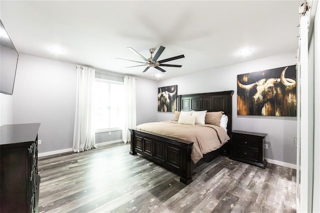 11475 Slate Cir, Rolla, MO 65401 - bedroom featuring wood finished floors, baseboards, and a ceiling fan