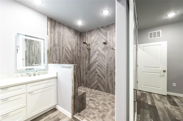 11475 Slate Cir, Rolla, MO 65401 - full bath featuring walk in shower, vanity, wood finished floors, and recessed lighting