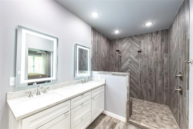 11475 Slate Cir, Rolla, MO 65401 - full bath featuring a walk in shower, double vanity, recessed lighting, and wood finished floors
