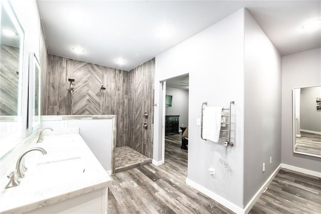 11475 Slate Cir, Rolla, MO 65401 - full bath with walk in shower, double vanity, wood finished floors, recessed lighting, and baseboards