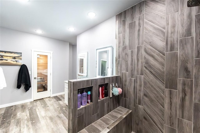 11475 Slate Cir, Rolla, MO 65401 - full bathroom with wood finished floors, tiled shower, vanity, recessed lighting, and baseboards