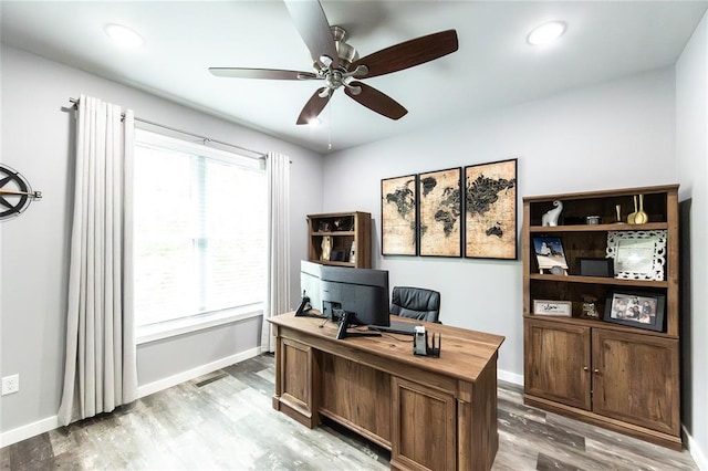 11475 Slate Cir, Rolla, MO 65401 - office with light wood-type flooring, a ceiling fan, and baseboards