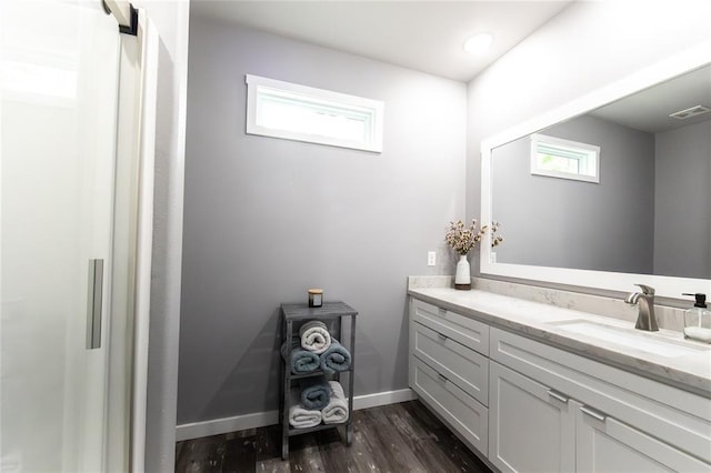 11475 Slate Cir, Rolla, MO 65401 - bathroom featuring vanity, wood finished floors, and baseboards