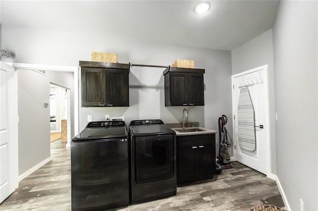 11475 Slate Cir, Rolla, MO 65401 - washroom with cabinet space, independent washer and dryer, wood finished floors, and baseboards