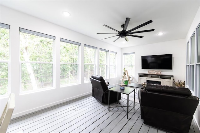 11475 Slate Cir, Rolla, MO 65401 - living area featuring a ceiling fan, light wood finished floors, a fireplace, recessed lighting, and baseboards
