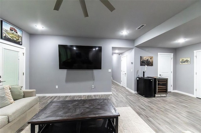 11475 Slate Cir, Rolla, MO 65401 - living area featuring wine cooler, ceiling fan, baseboards, light wood-style floors, and recessed lighting