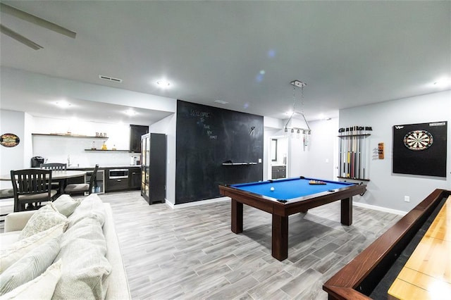 11475 Slate Cir, Rolla, MO 65401 - rec room with light wood finished floors, billiards table, baseboards, bar, and recessed lighting