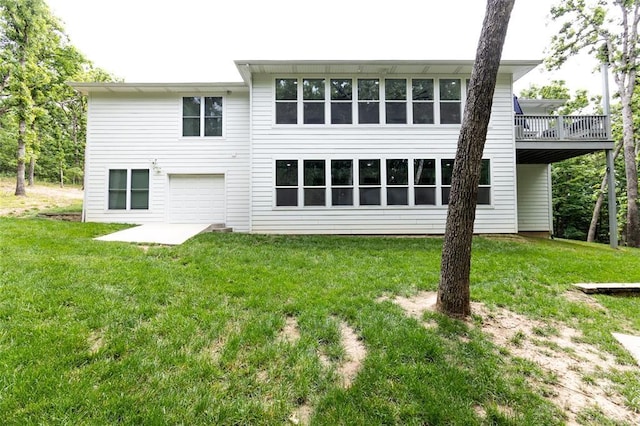 11475 Slate Cir, Rolla, MO 65401 - back of property with a lawn, a wooden deck, and an attached garage