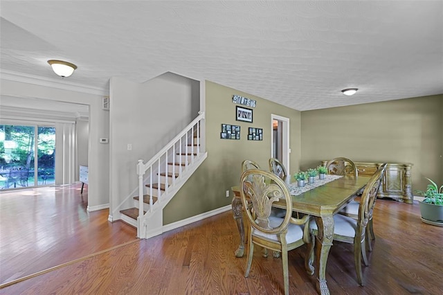5810 Sorrel Tree Ct, Saint Louis, MO 63129 - dining area featuring stairs, wood finished floors, baseboards, and a textured ceiling