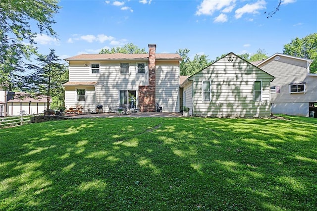 5810 Sorrel Tree Ct, Saint Louis, MO 63129 - back of house featuring a chimney, a patio, and a yard