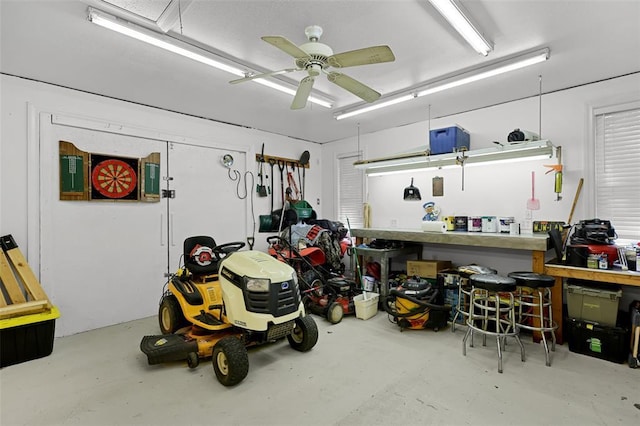 5810 Sorrel Tree Ct, Saint Louis, MO 63129 - garage with ceiling fan and a workshop area