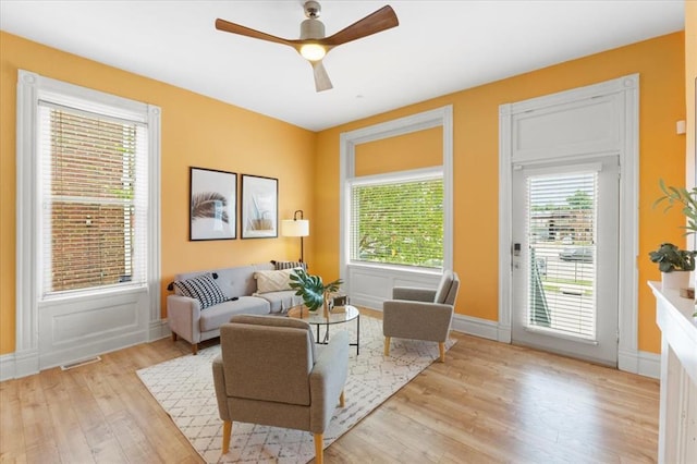 4366 Swan Ave, Saint Louis, MO 63110 - living area with light wood-type flooring, ceiling fan, and baseboards