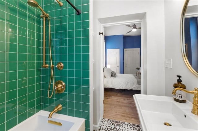 4366 Swan Ave, Saint Louis, MO 63110 - ensuite bathroom with a sink, a ceiling fan, and shower / washtub combination