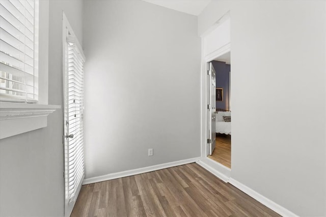 4366 Swan Ave, Saint Louis, MO 63110 - unfurnished bedroom featuring wood finished floors and baseboards