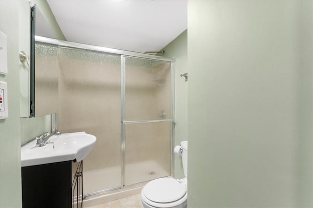 4366 Swan Ave, Saint Louis, MO 63110 - bathroom with vanity, toilet, a stall shower, and tile patterned floors