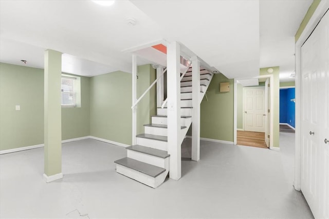 4366 Swan Ave, Saint Louis, MO 63110 - below grade area featuring stairs and baseboards