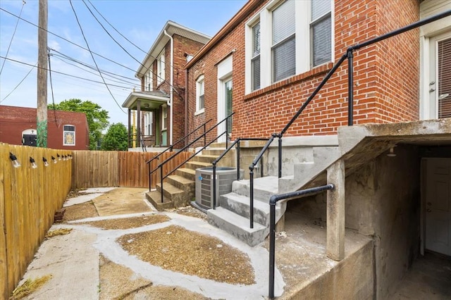 4366 Swan Ave, Saint Louis, MO 63110 - view of side of property with brick siding and cooling unit