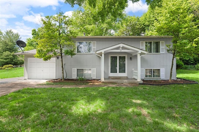 5 Braquewood Ct, Manchester, MO 63021 - bi-level home featuring concrete driveway, a garage, a front lawn, and french doors
