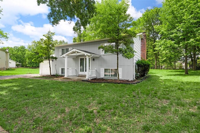 5 Braquewood Ct, Manchester, MO 63021 - split foyer home featuring an attached garage, a front yard, driveway, and a chimney