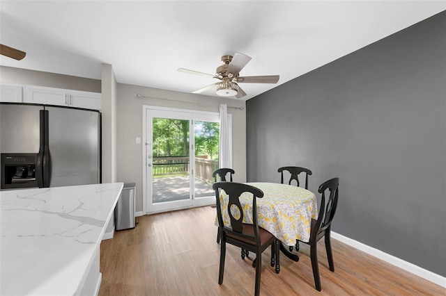 5 Braquewood Ct, Manchester, MO 63021 - dining area with ceiling fan, light wood-style floors, and baseboards