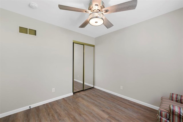 5 Braquewood Ct, Manchester, MO 63021 - unfurnished bedroom featuring wood finished floors, a closet, baseboards, and ceiling fan